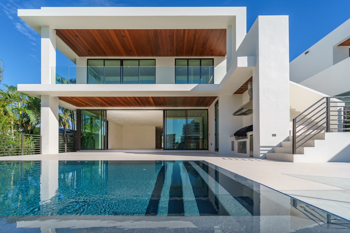 Contemporary two-story home exterior with floor-to-ceiling windows and infinity pool, Chester County, PA